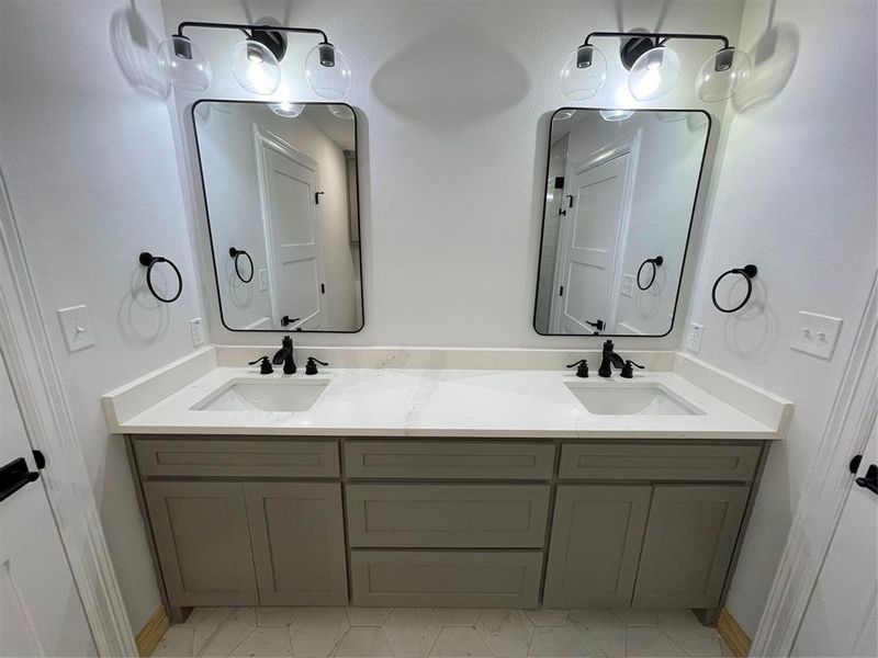 Bathroom with tile patterned flooring and vanity