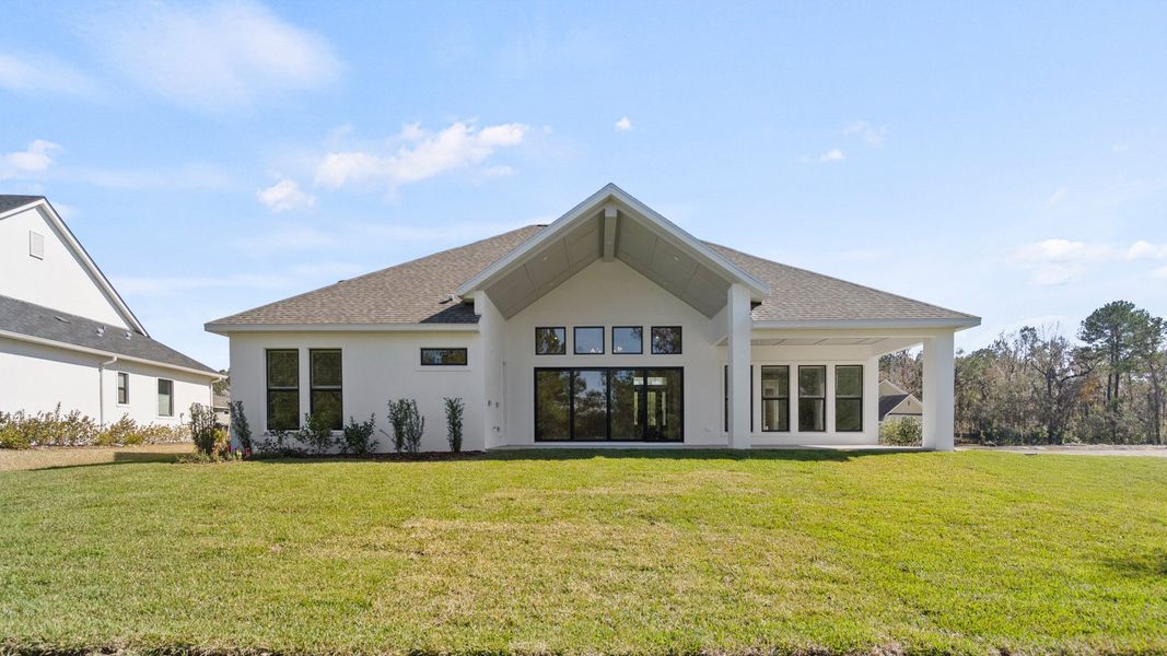 Representative exterior photo of a completed home built from the 2697F by Perry Homes in Southern Hills 80', Brooksville, FL (Image 8).