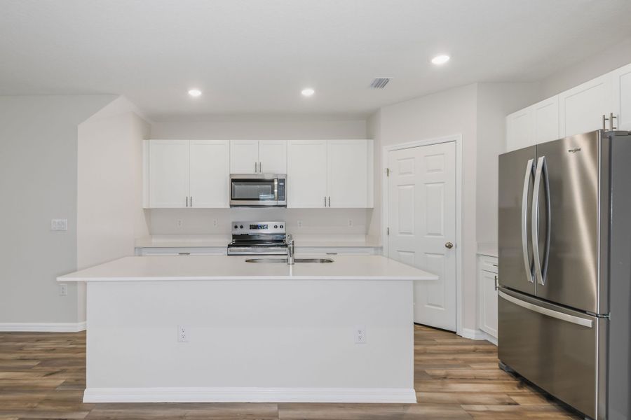 Furnished interior view inside a new home in Pasadena Woods, Dade City (Image 6).