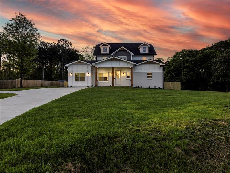 Front exterior of a new home in , Loganville, GA, highlighting curb appeal (Image 24).