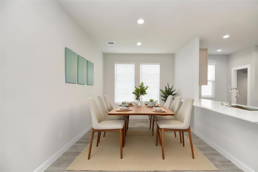 *Virtually Staged* Dining Area. Sample photo of completed home with similar floor plan. Actual colors and selections may vary.