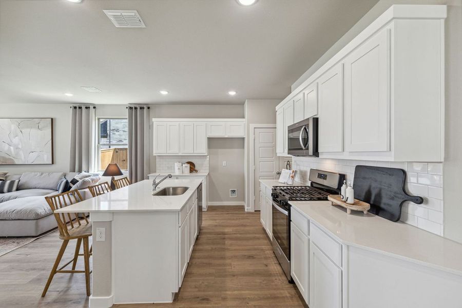 Kitchen in the Oak home plan by Trophy Signature Homes