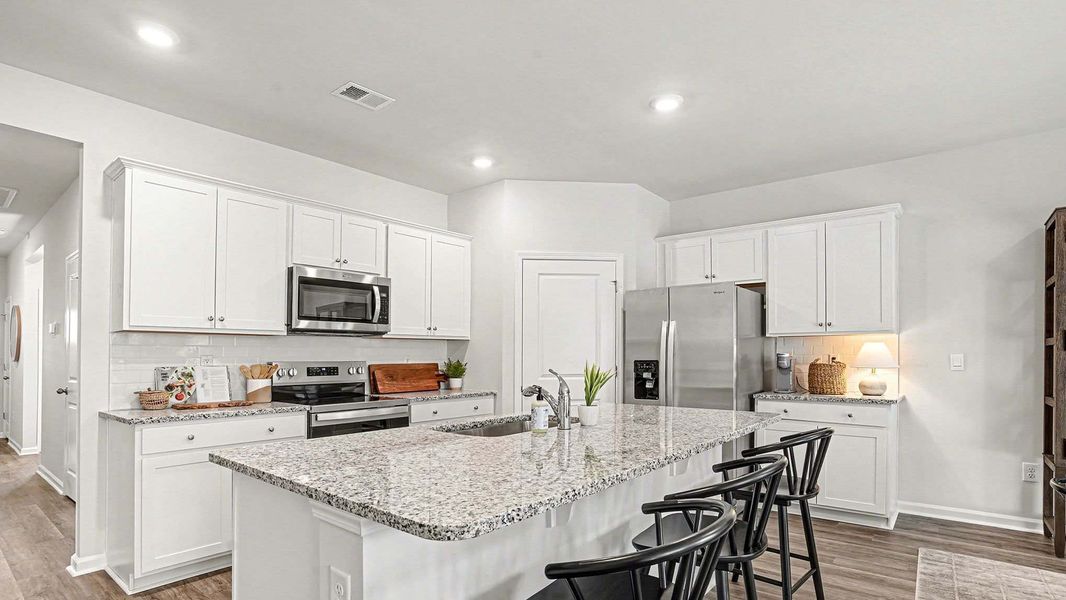 Furnished interior view inside a new home in Stanbury Creek, Supply (Image 7).