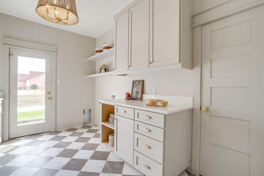 utility room with laundry basket storage utility room with laundry basket storage