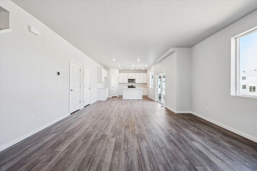 A long hallway with white doors. A long hallway with white doors.