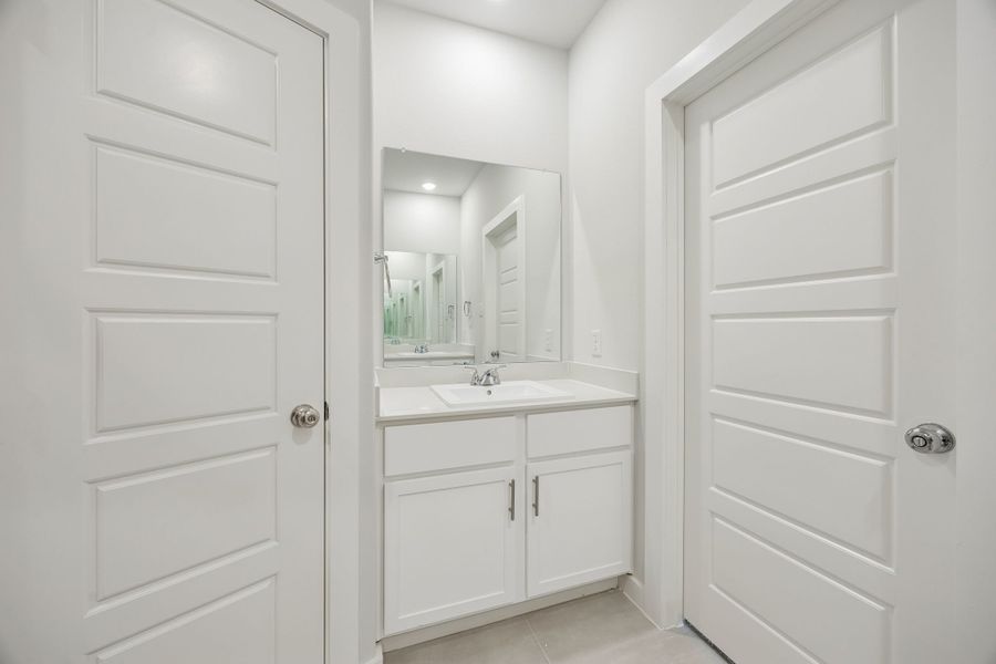 Primary Bathroom in the Birch home plan by Trophy Signature Homes – REPRESENTATIVE PHOTO