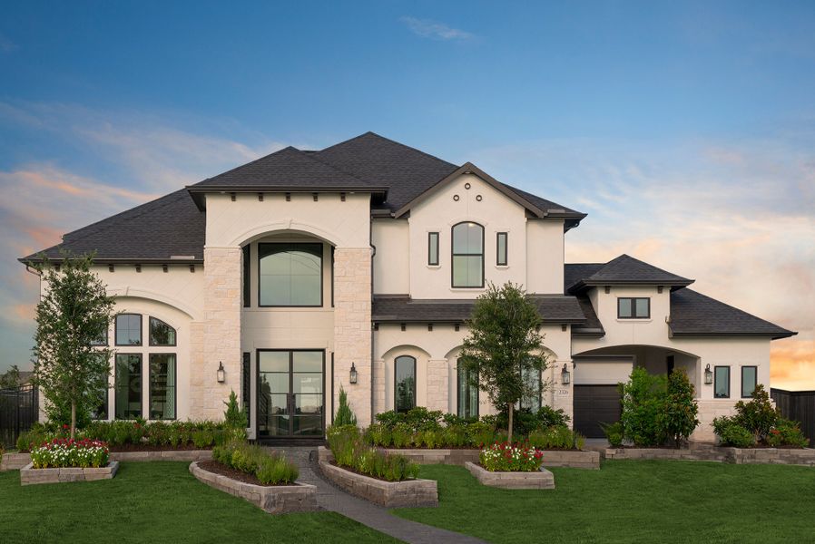 Front exterior of a new home in Harvest Green, Richmond, TX, highlighting curb appeal (Image 1). Front exterior of a new home in Harvest Green, Richmond, TX, highlighting curb appeal (Image 1).