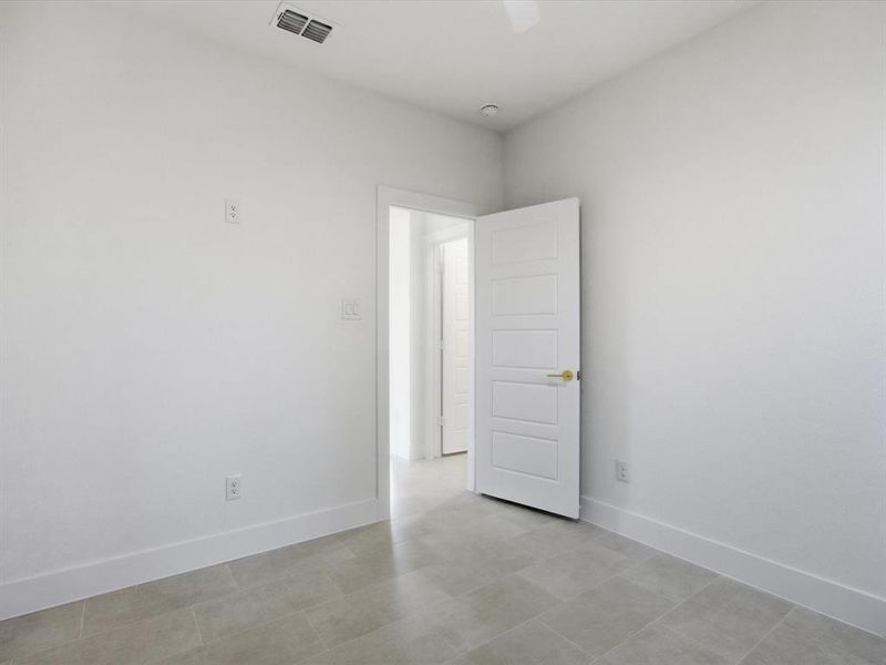 Empty room featuring baseboards