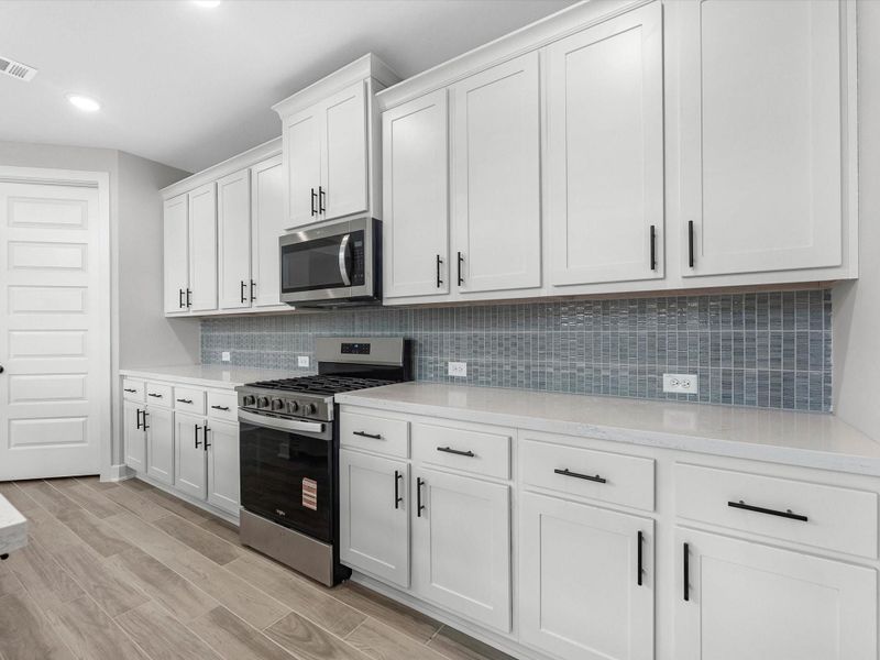 Furnished interior view inside a new home in Sienna, Missouri City (Image 5).