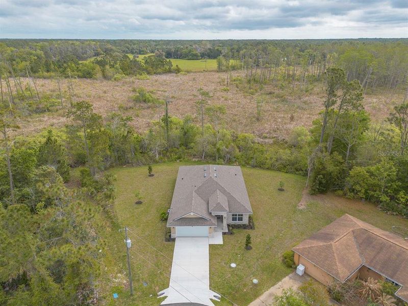 Front exterior of a new home in Palm Coast, Palm Coast, FL, highlighting curb appeal (Image 23).
