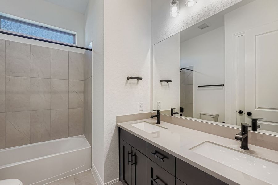 Furnished interior view inside a new home in 6 Creeks, Kyle (Image 5).