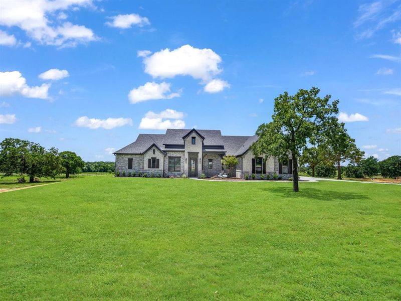 Front exterior of a new home in , Decatur, TX, highlighting curb appeal (Image 25). Front exterior of a new home in , Decatur, TX, highlighting curb appeal (Image 25).