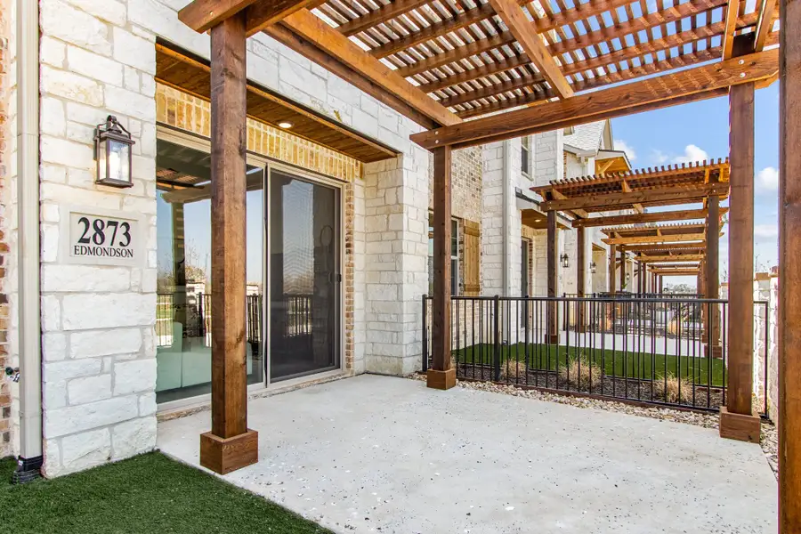 Exterior details and patio area of a home in The Tribute, The Colony (Image 2). Exterior details and patio area of a home in The Tribute, The Colony (Image 2).
