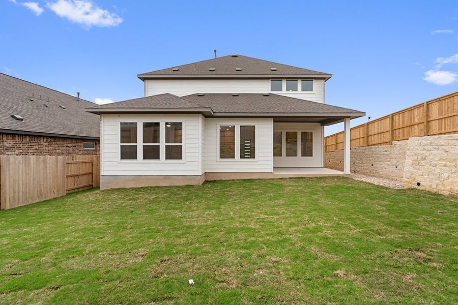 Exterior details and patio area of a home in Park Collection at Lariat, Liberty Hill (Image 30).
