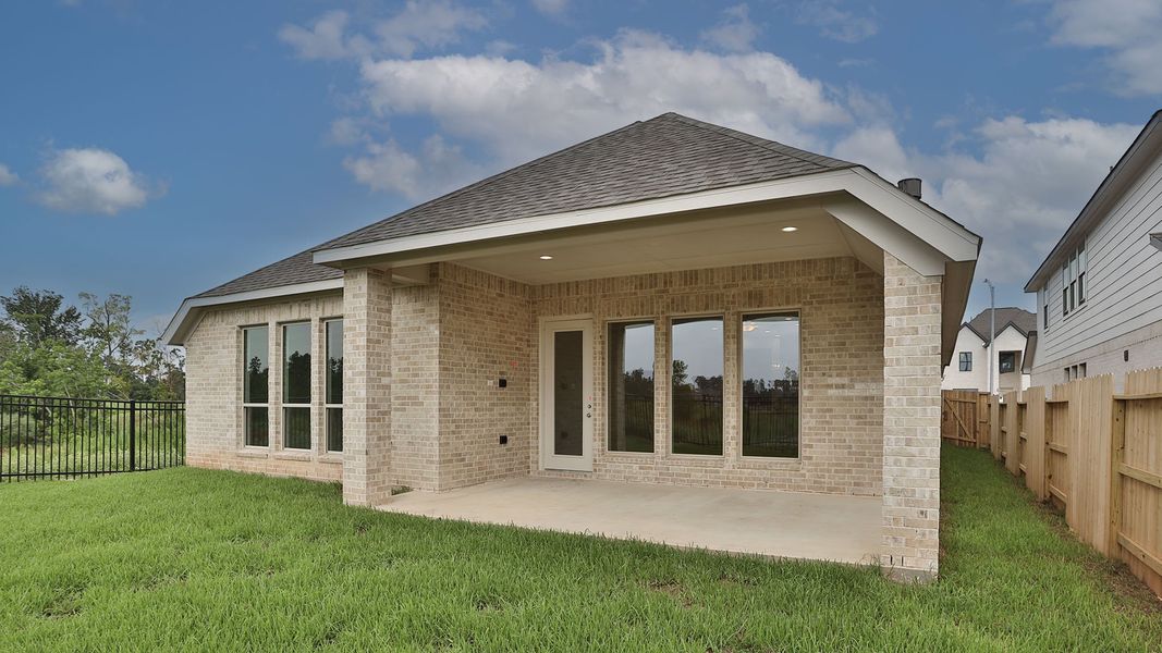 Front exterior of a new home in Grand Central Park 50', Conroe, TX, highlighting curb appeal (Image 2). Front exterior of a new home in Grand Central Park 50', Conroe, TX, highlighting curb appeal (Image 2).