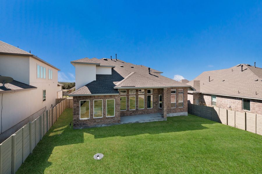 Exterior details and patio area of a home in The Grove at Vintage Oaks, New Braunfels (Image 3).