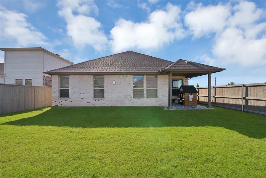 Exterior details and patio area of a home in Pecan Square, Northlake (Image 24).