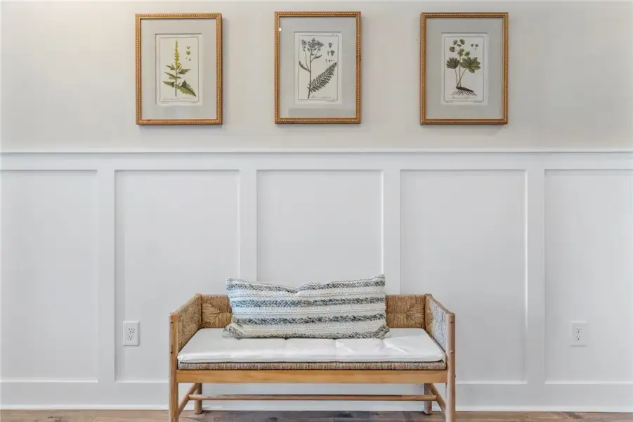 This inviting space features classic wainscoting a