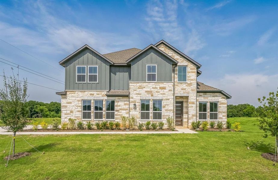 Front exterior of a new home in Eagle Estates, Cross Timber, TX, highlighting curb appeal (Image 2).