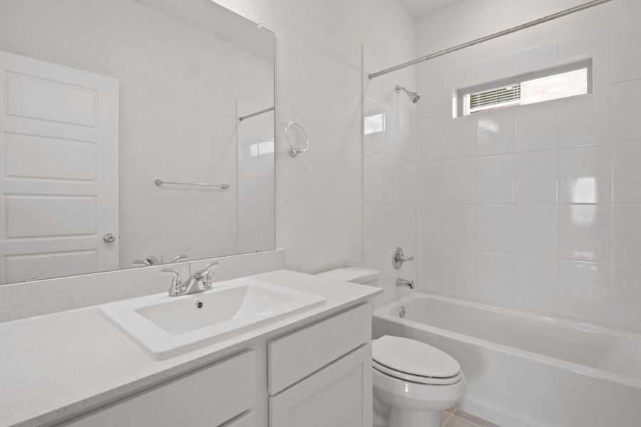 Bathroom in the Pecan II home plan by Trophy Signature Homes – REPRESENTATIVE PHOTO