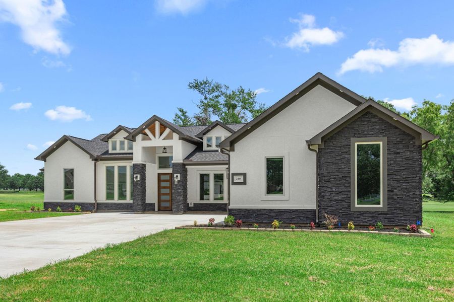 Front exterior of a new home in , Hempstead, TX, highlighting curb appeal (Image 25). Front exterior of a new home in , Hempstead, TX, highlighting curb appeal (Image 25).