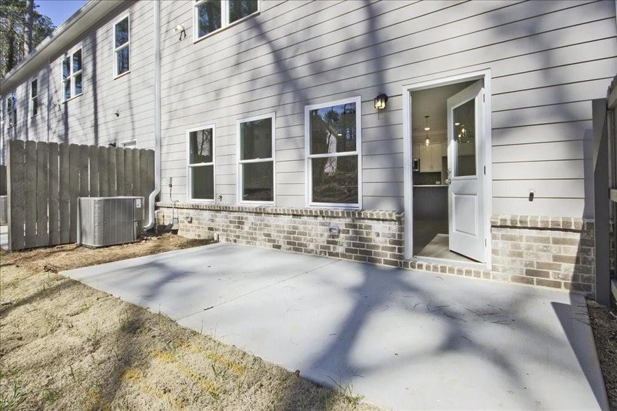 Front exterior of a new home in River Walk Place, Lawrenceville, GA, highlighting curb appeal (Image 17).