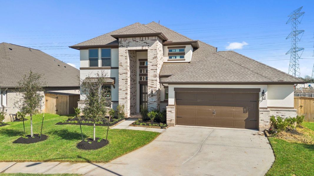 Front exterior of a new home in Coastal Point, League City, TX, highlighting curb appeal (Image 21).
