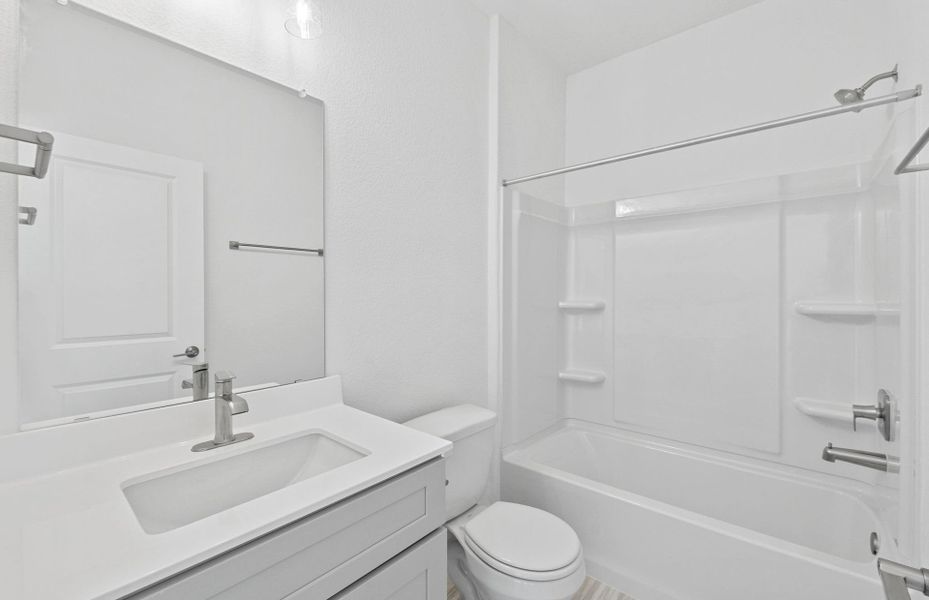 Furnished interior view inside a new home in Crosswinds, Kyle (Image 11).