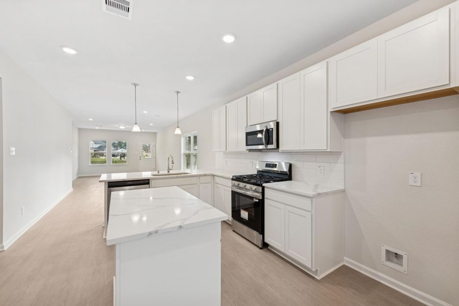 The Cardinal II- Kitchen. Photos of home shown are for illustration only; actual features, colors, and upgrades may vary. The Cardinal II- Kitchen. Photos of home shown are for illustration only; actual features, colors, and upgrades may vary.