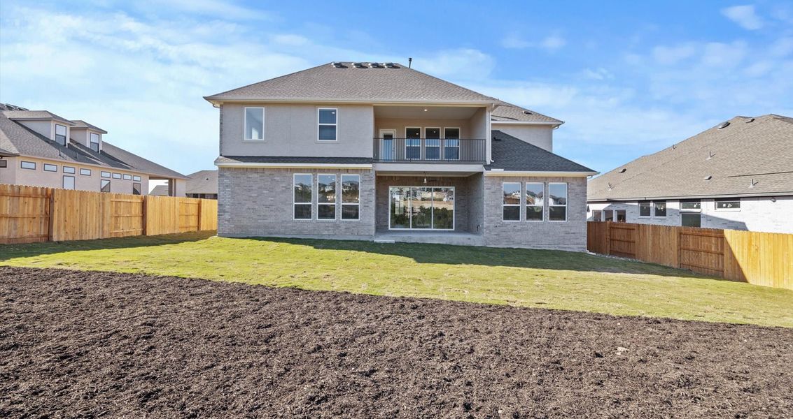 Representative exterior photo of a completed home built from the Raegan by Chesmar Homes in Sweetwater, Austin, TX (Image 2).