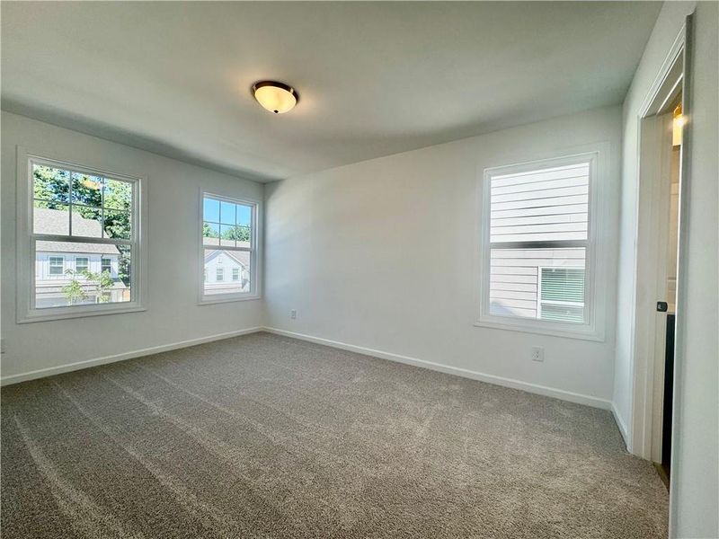 Spacious, unfurnished interior of a new home in Eastlyn Crossing, Flowery Branch (Image 29).