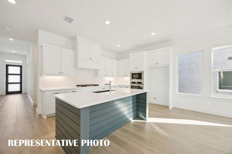 Featuring site lines from the front through to the rear of the home, our Elise plan offers a beautiful open and flowing floor plan that the entire family will love!  REPRESENTATIVE PHOTO