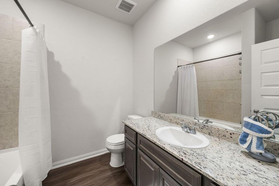 Hall bathroom with tub/shower combo.
