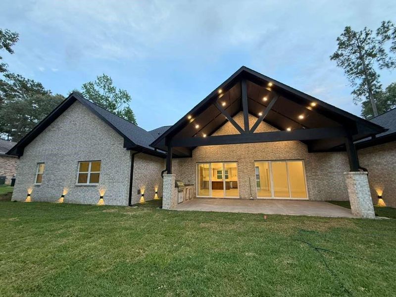 Elegant exterior lighting enhances both curb appeal and outdoor living spaces.