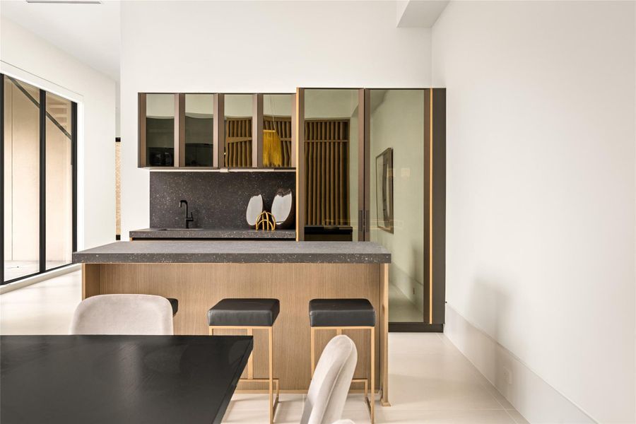 Dining with a side of sophistication—an elegant wet bar designed for effortless entertaining.