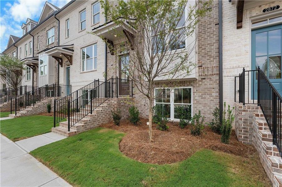 Exterior details and patio area of a home in Evanshire Townhomes, Duluth (Image 27). Exterior details and patio area of a home in Evanshire Townhomes, Duluth (Image 27).