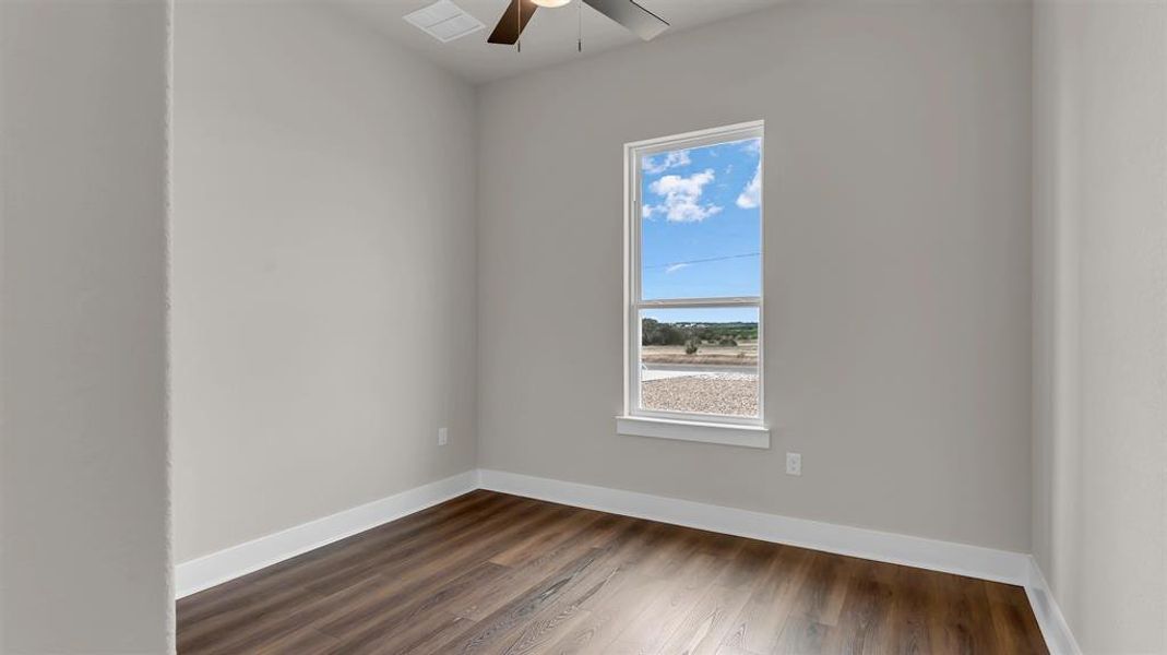 Rich wood floors and a tall window define this versatile interior space. Rich wood floors and a tall window define this versatile interior space.