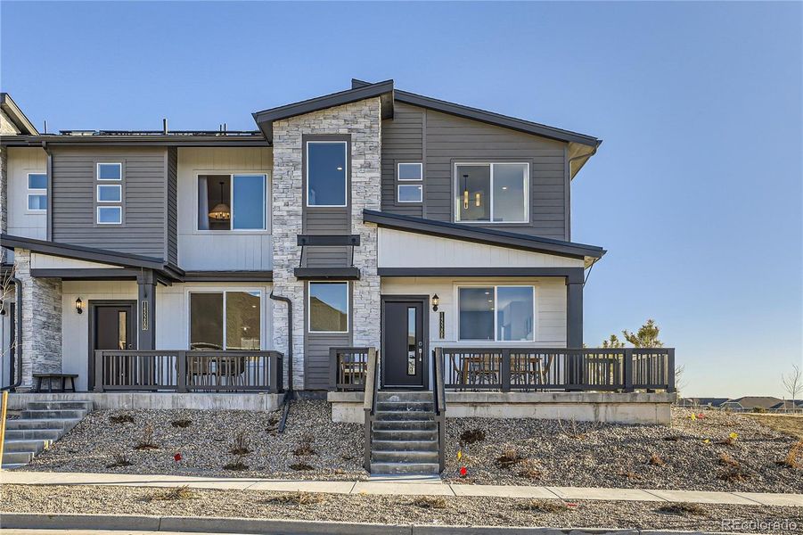 Front exterior of a new home in , Arvada, CO, highlighting curb appeal (Image 1).
