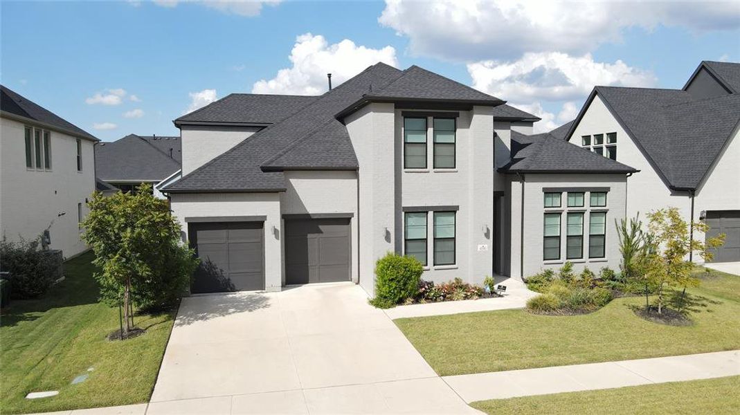 Front exterior of a new home in , Prosper, TX, highlighting curb appeal (Image 1).