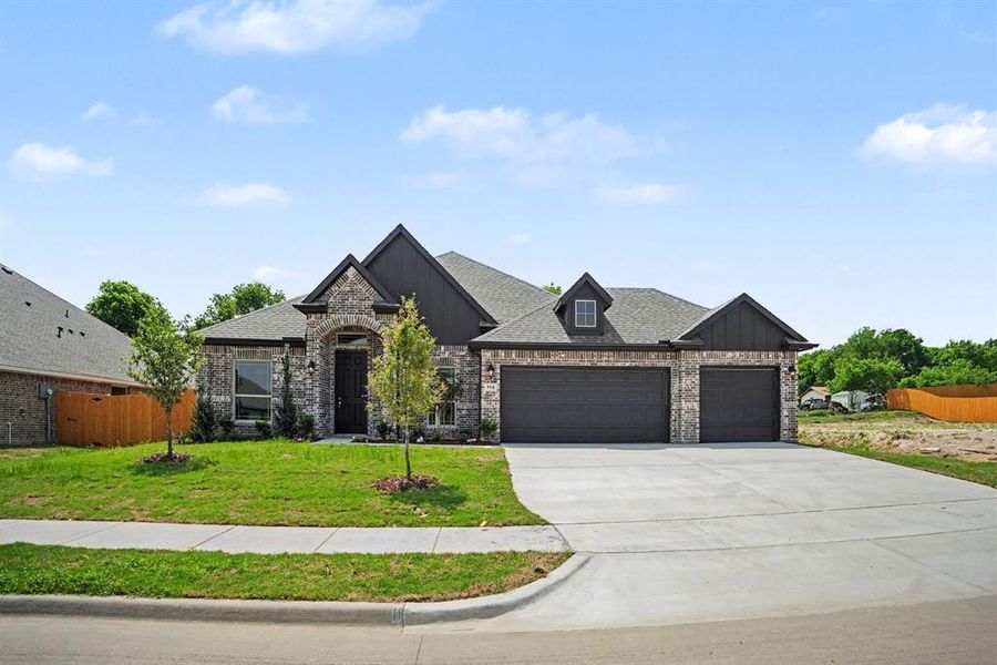 Front exterior of a new home in Cole Crossing Estates, DeSoto, TX, highlighting curb appeal (Image 20). Front exterior of a new home in Cole Crossing Estates, DeSoto, TX, highlighting curb appeal (Image 20).