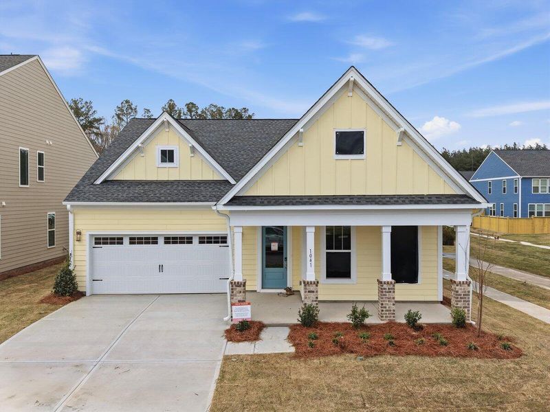 Front exterior of a new home in , Ravenel, SC, highlighting curb appeal (Image 1). Front exterior of a new home in , Ravenel, SC, highlighting curb appeal (Image 1).