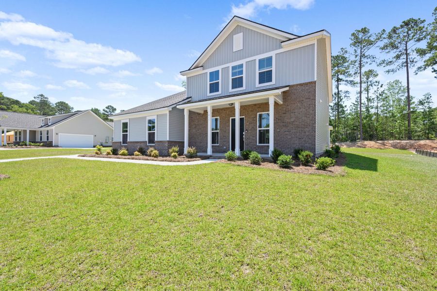 Front exterior of a new home in Oakleaf Chase, Blythewood, SC, highlighting curb appeal (Image 21). Front exterior of a new home in Oakleaf Chase, Blythewood, SC, highlighting curb appeal (Image 21).