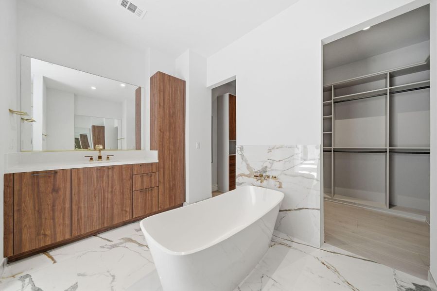 Primary Bath invites relaxation with deep soaking tub, oversized shower & dual separate vanities. Primary Bath invites relaxation with deep soaking tub, oversized shower & dual separate vanities.
