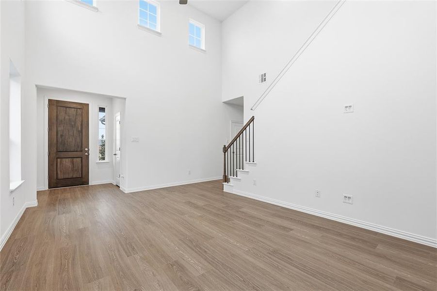 Entryway featuring wood finished floors and stairway