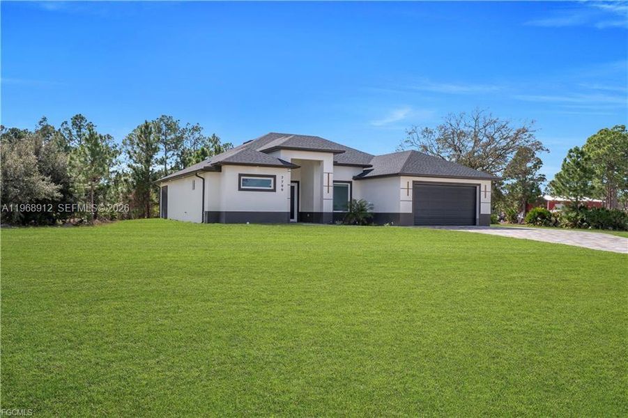 Front exterior of a new home in , Labelle, FL, highlighting curb appeal (Image 21).