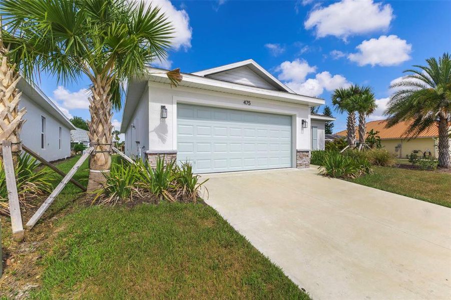 Front exterior of a new home in , Port Charlotte, FL, highlighting curb appeal (Image 25). Front exterior of a new home in , Port Charlotte, FL, highlighting curb appeal (Image 25).