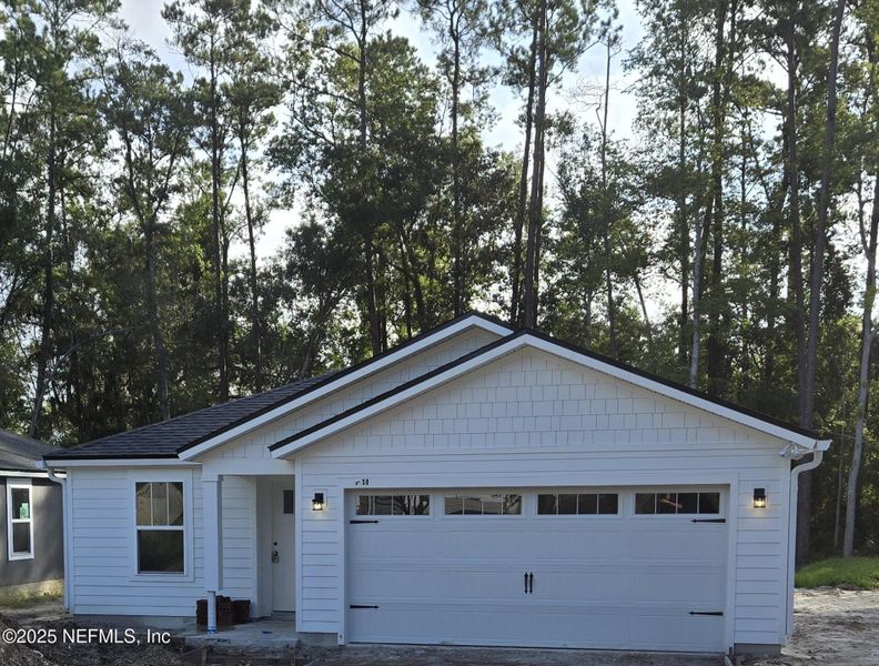 Front exterior of a new home in , Jacksonville, FL, highlighting curb appeal (Image 1). Front exterior of a new home in , Jacksonville, FL, highlighting curb appeal (Image 1).