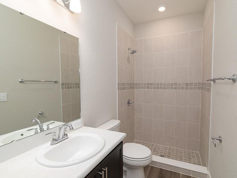 Bath 3 is located next to bedroom 4 - Savannah by Highland Homes