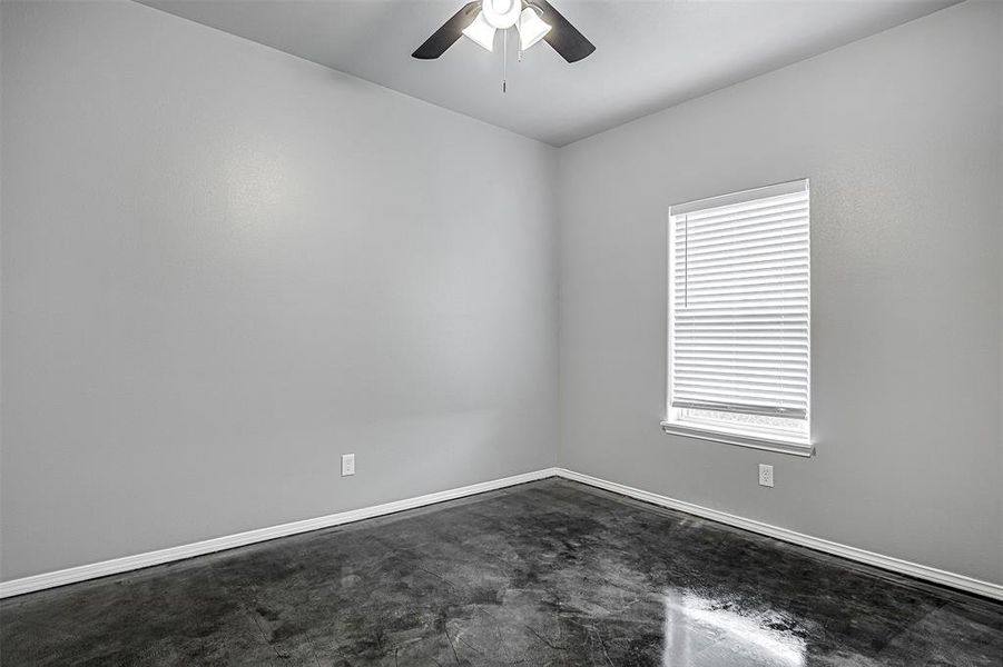 Spare room with ceiling fan