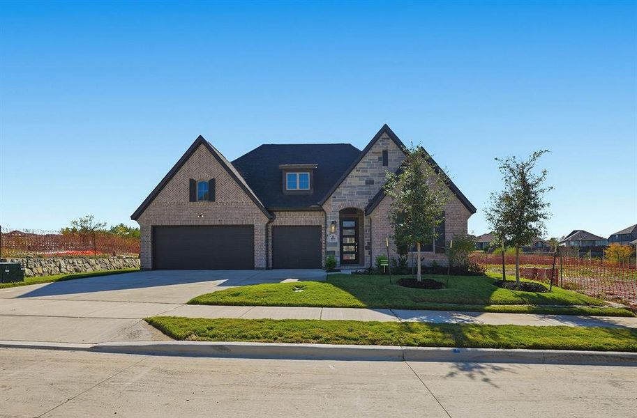 Front exterior of a new home in Devonshire, Forney, TX, highlighting curb appeal (Image 20). Front exterior of a new home in Devonshire, Forney, TX, highlighting curb appeal (Image 20).